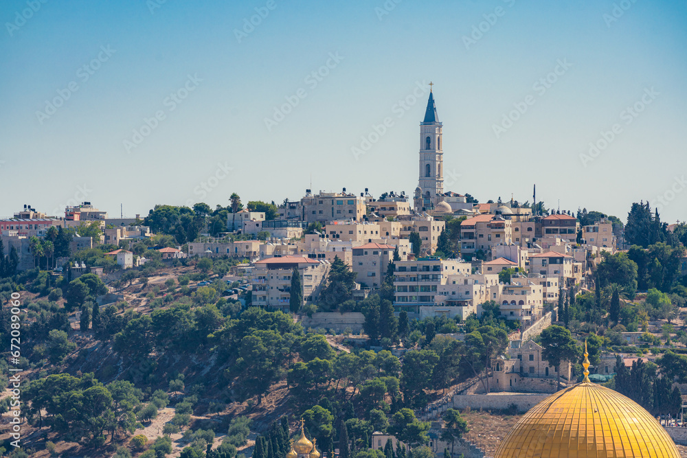 Fototapeta premium View of the Mount of Olives in Jerusalem with a bell tower on top of it
