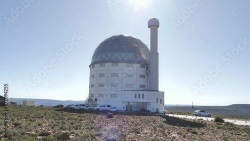 Sutherland, South Africa - September 27, 2023:  Rotate around SALT telescope building on Karoo hilltop photo