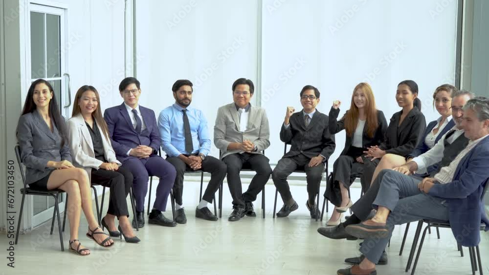 excited diverse group of business team building sitting in circle meeting celebrating to success goal raised arms or fists up to motivation in seminar conference . excited diverse group of business team building sitting in circle meeting celebrating to success goal raised arms or fists up to motivation in seminar conference .