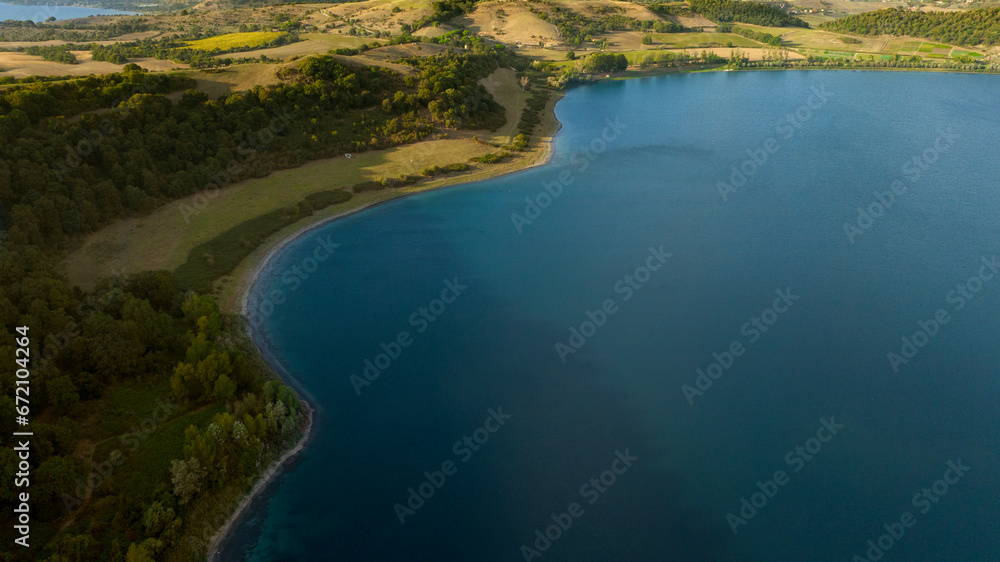 Aerial view of Lake Martignano, originally called Lake Alsietino. It is an endorheic lake of volcanic origin located in Lazio, Italy. Aerial view of Lake Martignano, originally called Lake Alsietino. It is an endorheic lake of volcanic origin located in Lazio, Italy.