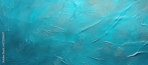 Background with a texture of metallic foil paper in shades of blue and green