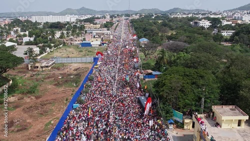 Drone shot of massive crowd gathered on the city highway for a Hindu religious event