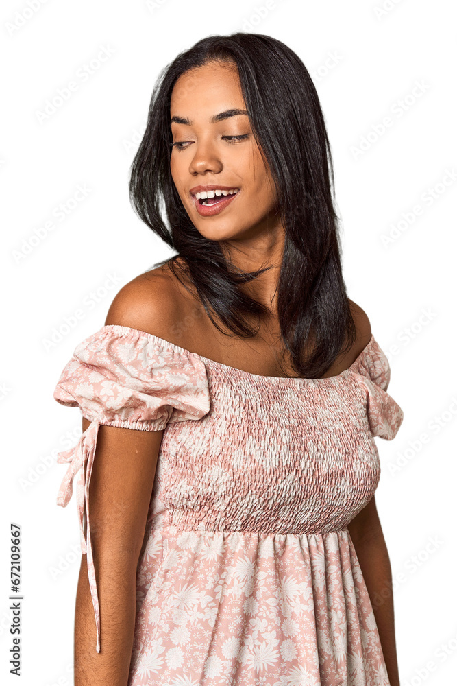 Young Filipina with long black hair in studio looks aside smiling, cheerful and pleasant. Young Filipina with long black hair in studio looks aside smiling, cheerful and pleasant.