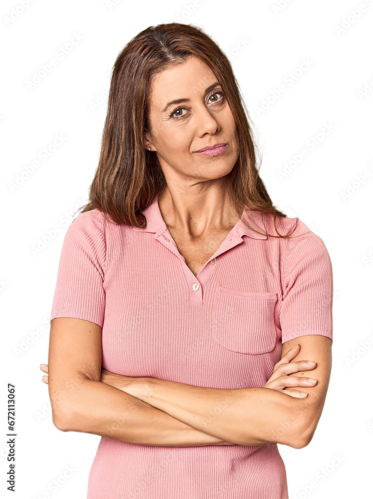 Middle-aged woman portrait in studio setting suspicious, uncertain, examining you. Middle-aged woman portrait in studio setting suspicious, uncertain, examining you.