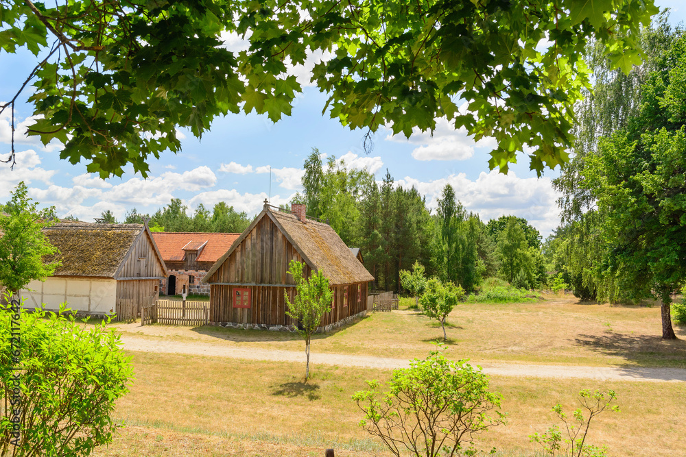 Small cozy houses. Wooden ancient buildings. Summer village and vacation. Farm bio products. Small cozy houses. Wooden ancient buildings. Summer village and vacation. Farm bio products.