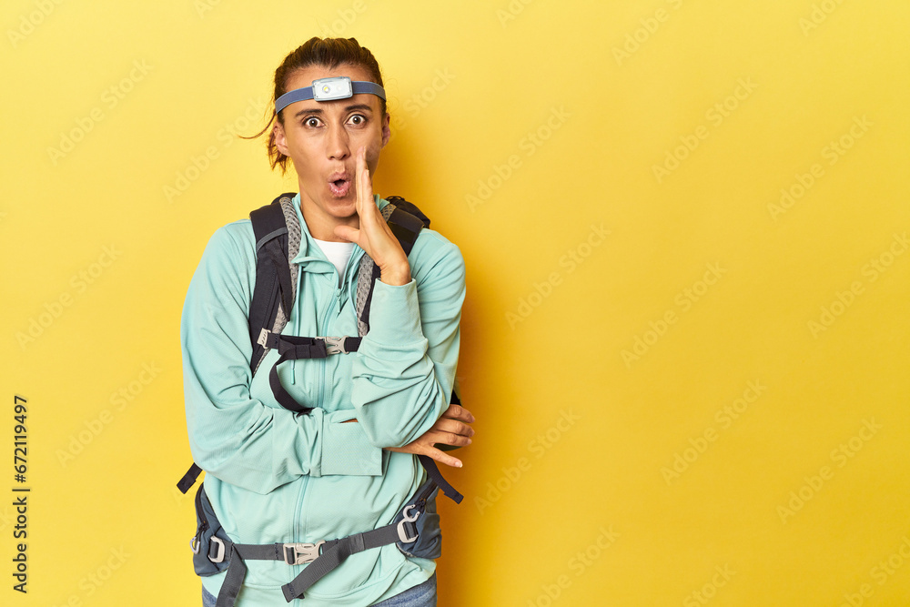 Mountain gear and frontal light on yellow is saying a secret hot braking news and looking aside Mountain gear and frontal light on yellow is saying a secret hot braking news and looking aside