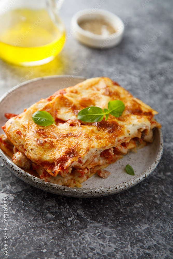 Traditional homemade lasagna with fresh basil