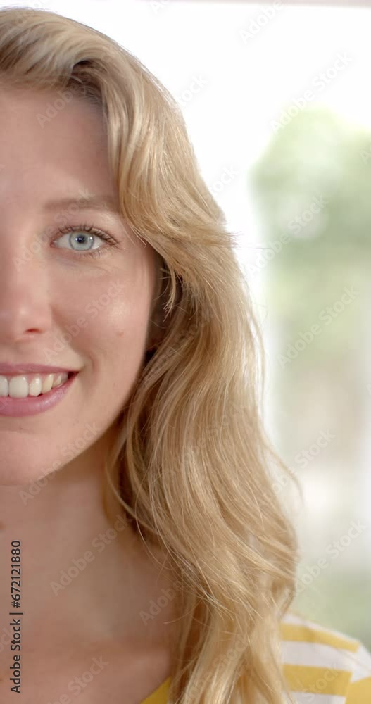 Vertical video of portrait of caucasian woman with blond hair at home, slow motion Vertical video of portrait of caucasian woman with blond hair at home, slow motion