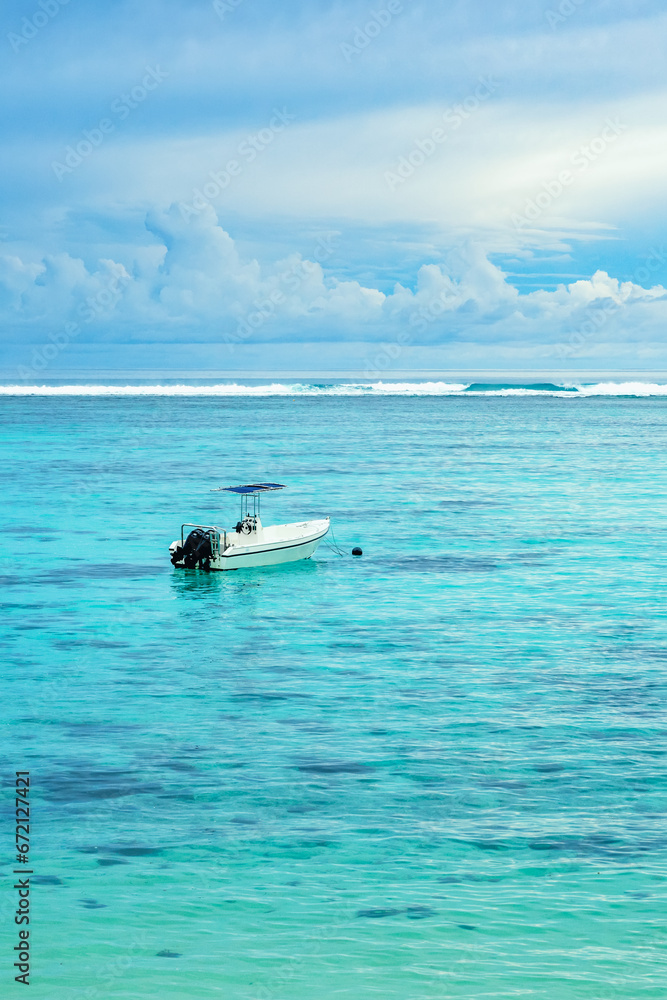 Naklejka premium Lonely small boat in ocean