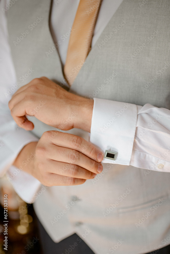 A young businessman is getting dressed
for a meeting. The beginning of a new working week.
A young businessman is getting dressed
for a meeting. The beginning of a new working week.