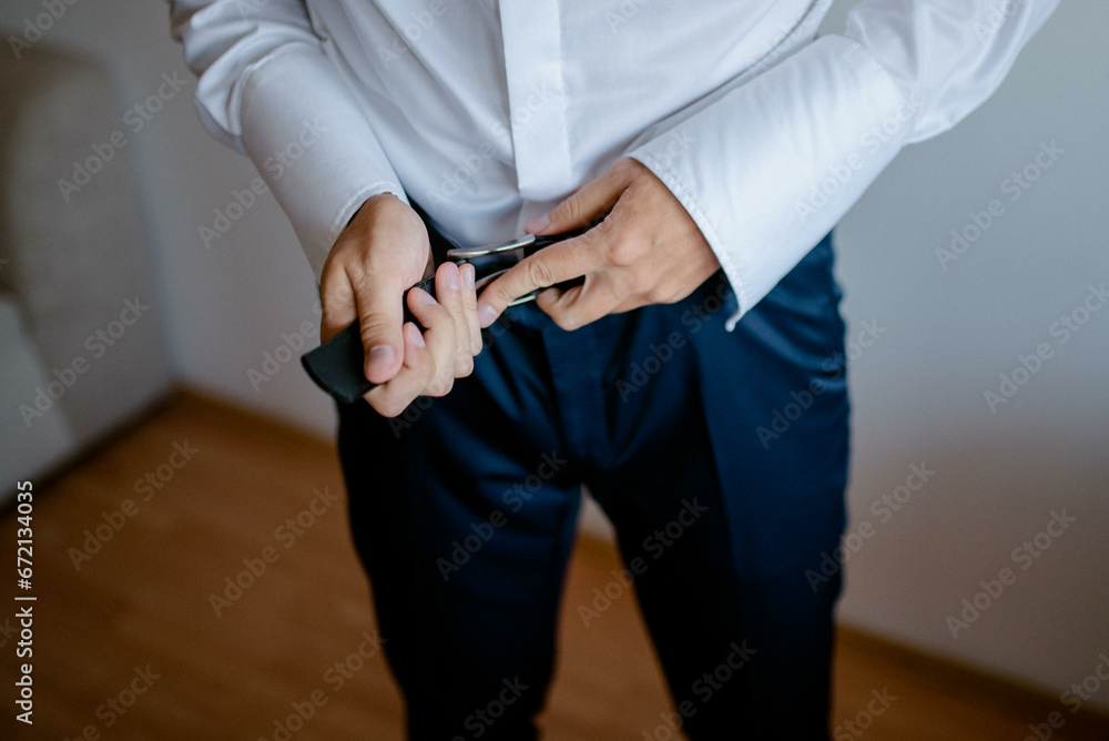 A young businessman is getting dressed
for a meeting. The beginning of a new working week.
A young businessman is getting dressed
for a meeting. The beginning of a new working week.
