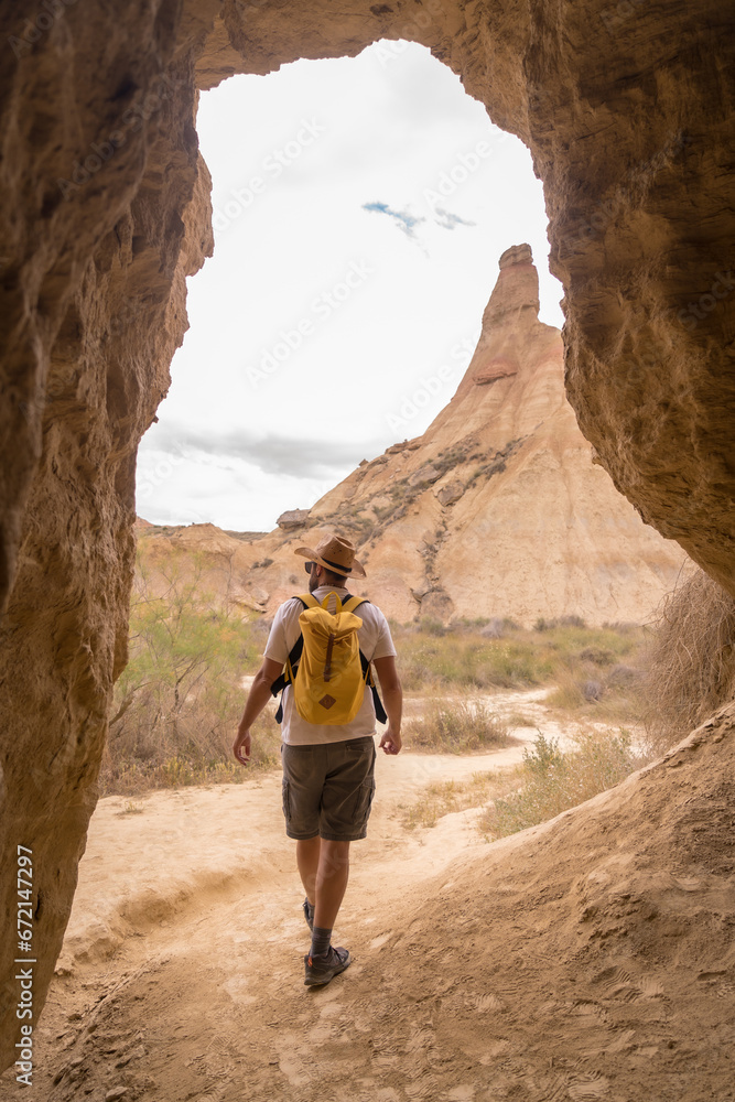 Man walking along a arid natural park