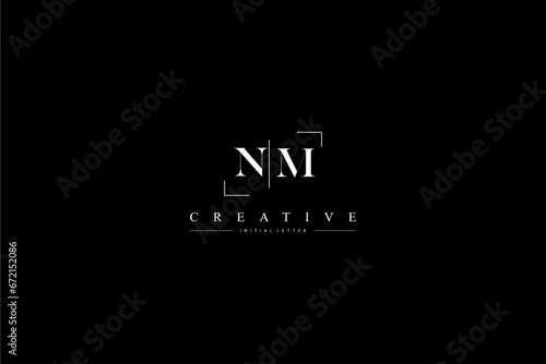 minimalist NM initial logo with simple vertical stroke line in black photo