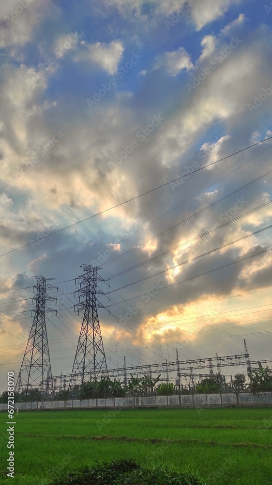 power plant in suburban area next to the rice field power plant in suburban area next to the rice field