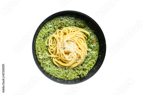 Spaghetti pasta with spinach in cream sauce with parmesan in a pan. Transparent background. Isolated