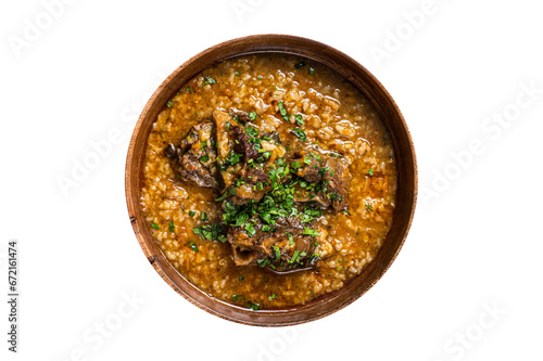 Georgian Kharcho lamb meat soup with rice, tomatoes and spices in a wooden bowl. Transparent background. Isolated
