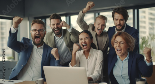 Group of excited diverse business employees with laptop, screaming celebrating good news and corporate success. Happy multiethnic colleagues feeling motivated ecstatic and overjoyed in office. photo