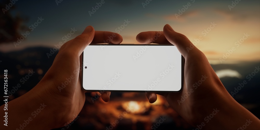 Fotobehang Chocoladebruin CU Caucasian male using his phone near campsite in the evening, screen mockup #672163418