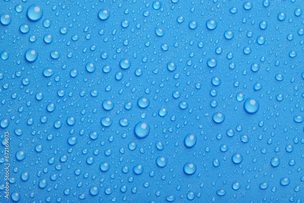 Blue water drops background close-up