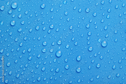Blue water drops background close-up
