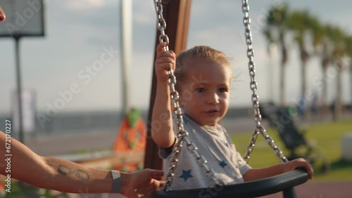Happy child swing up. Children's entertainment outside, good time life style moment, childhood dream fly. High quality 4k footage