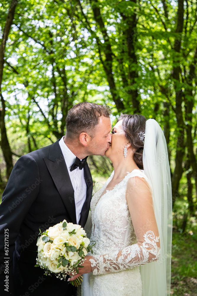happy bride and groom posing on their wedding day happy bride and groom posing on their wedding day