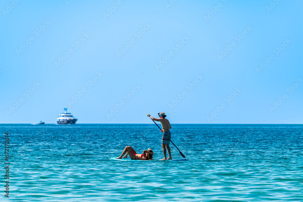 Stand Up Paddle at the sea, Corsica, France - obrazy, fototapety, plakaty 