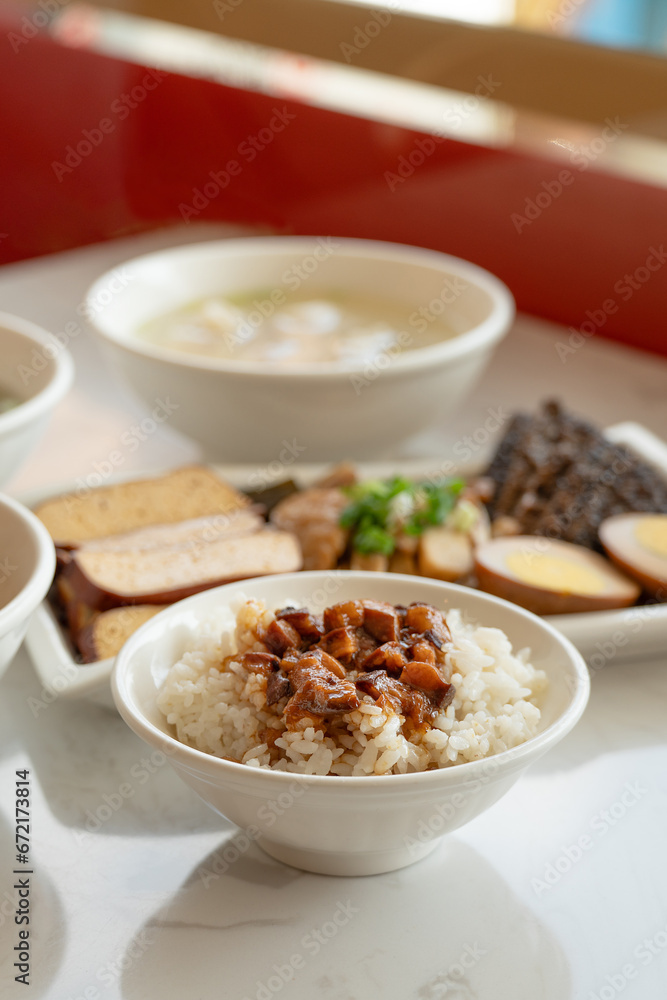 Braised meat over cooked rice, famous and delicious street food in Taiwanese restaurant. Braised meat over cooked rice, famous and delicious street food in Taiwanese restaurant.