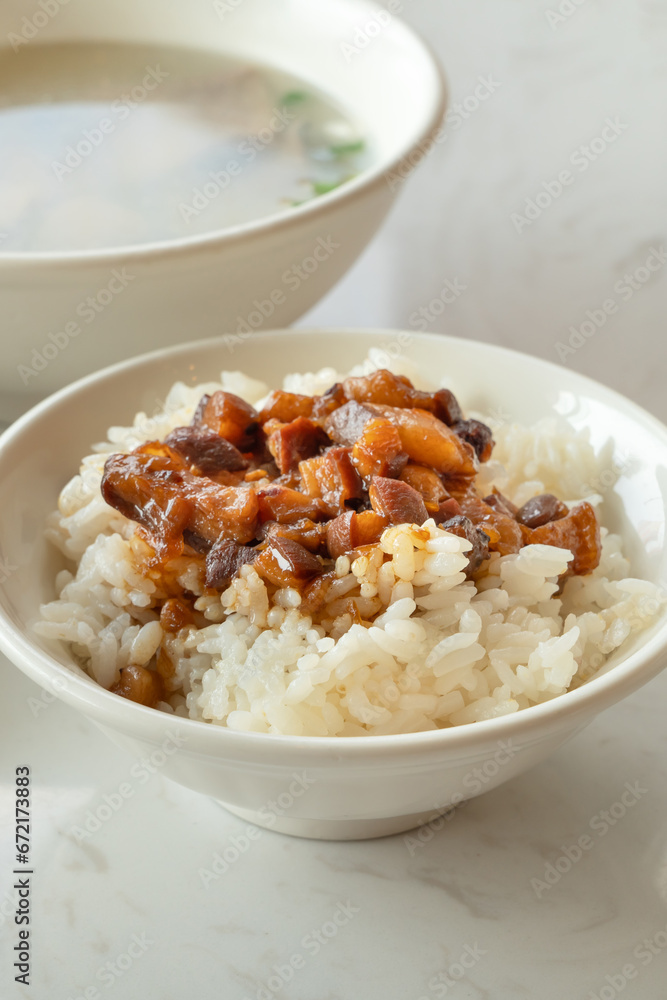 Braised meat over cooked rice, famous and delicious street food in Taiwanese restaurant. Braised meat over cooked rice, famous and delicious street food in Taiwanese restaurant.