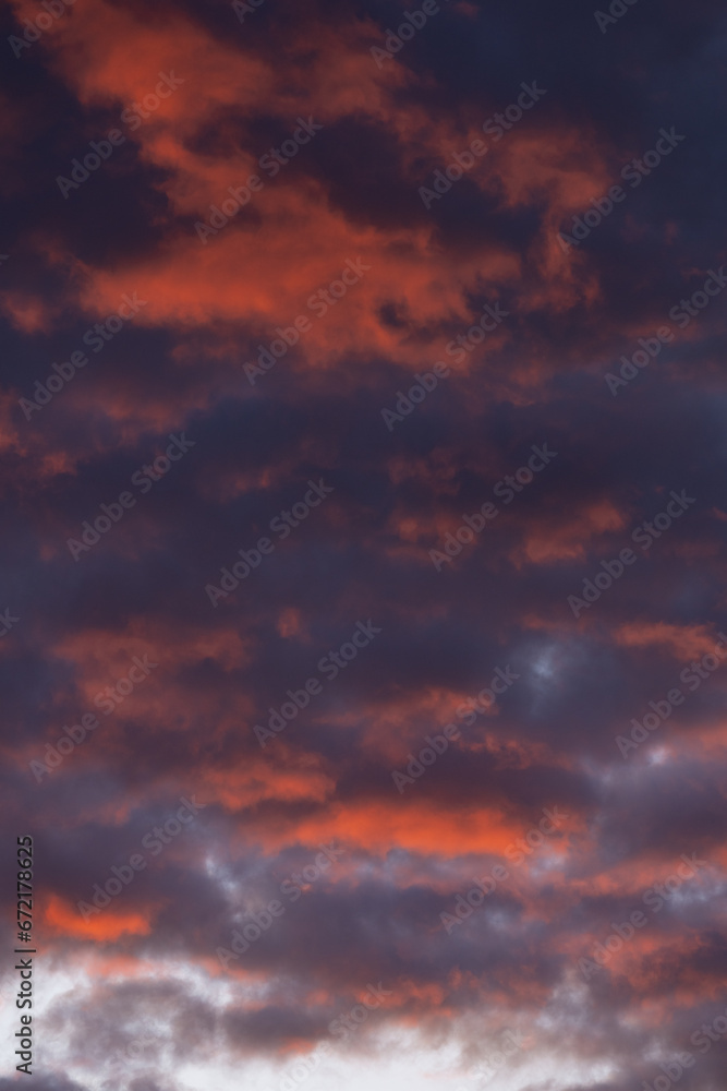 Stunning sunrise with beautiful shades of orange, pink, purple and blue colors. Wallpaper, natural background with copy space.
