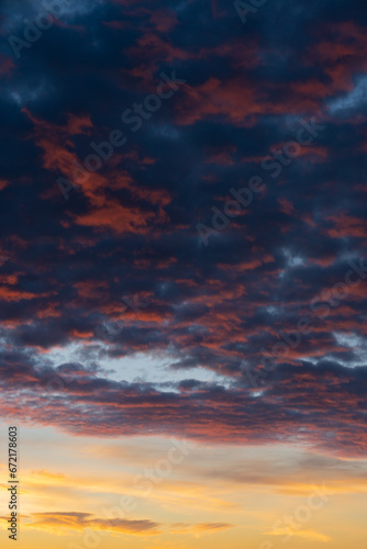Obraz na płótnie Stunning sunrise with beautiful shades of orange, pink, purple and blue colors. Wallpaper, natural background with copy space. w salonie