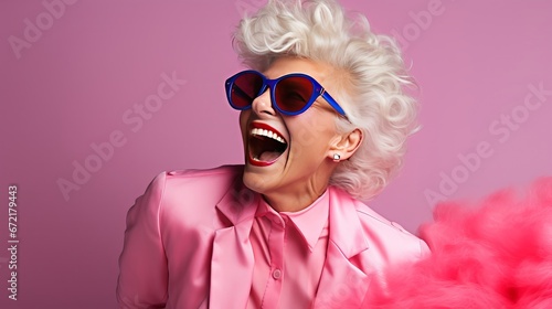 Portrait of a beautiful senior woman in sunglasses over pink background. Generative Ai. 