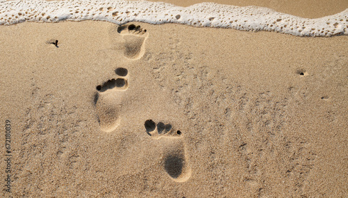 Footsteps or footprints in the sand, desert, beach
