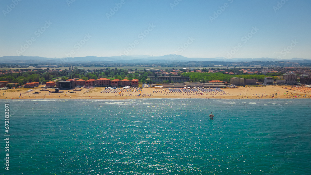 Vacation in italy. Landscape with aerial view of Rimini, Italia. Rimini public beach. Wonderful summer scene of Italy, Europe. Superb evening view of Adriatic coast. Traveling concept background.