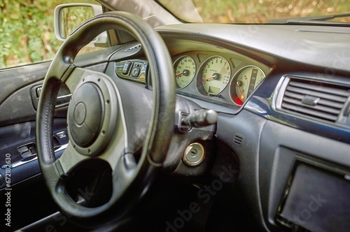 Car steering wheel and car sensors, inerior background, modern city car elements close view. Car inside interior