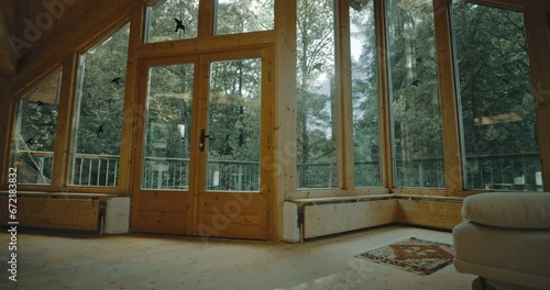 Living room surrounded by windows