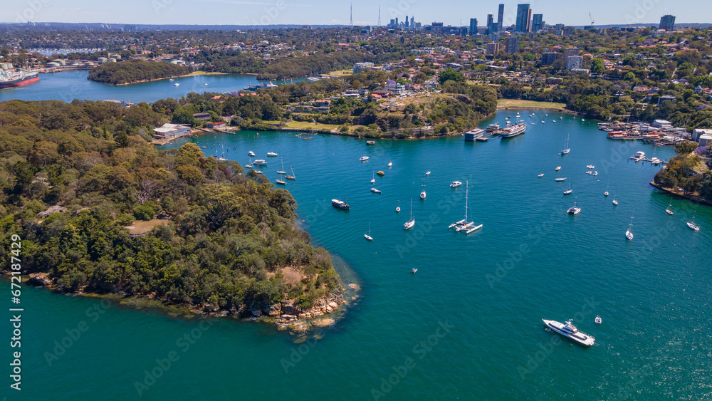 Fototapeta premium Aerial drone view of Berrys Bay and Balls Head Reserve at Waverton on the lower North Shore of Sydney, New South Wales, Australia on a sunny day 