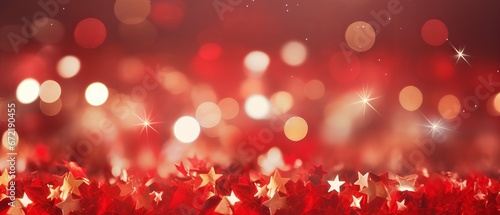 Sparkling red Christmas background with golden stars. Festive and glowing holiday texture