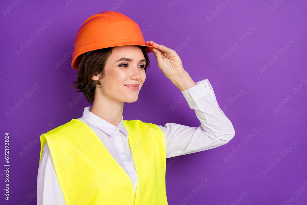 Profile photo of optimistic nice brunette hair lady wear builder uniform isolated on vivid purple color background Profile photo of optimistic nice brunette hair lady wear builder uniform isolated on vivid purple color background