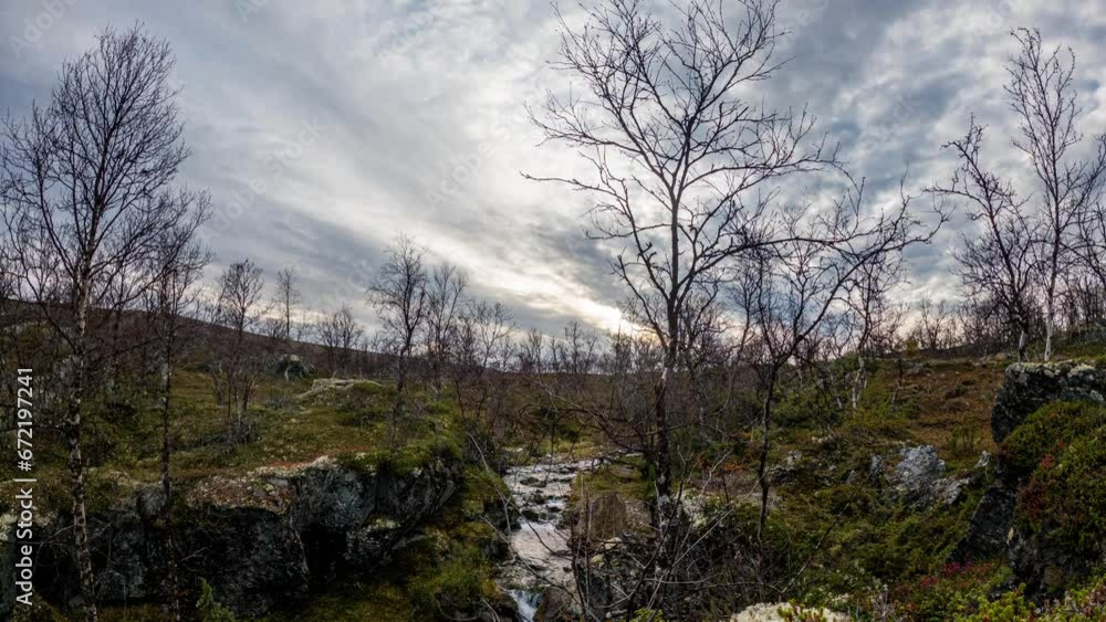 Time Lapse - Arctic stream and sun set in the wilderness. Time Lapse - Arctic stream and sun set in the wilderness.