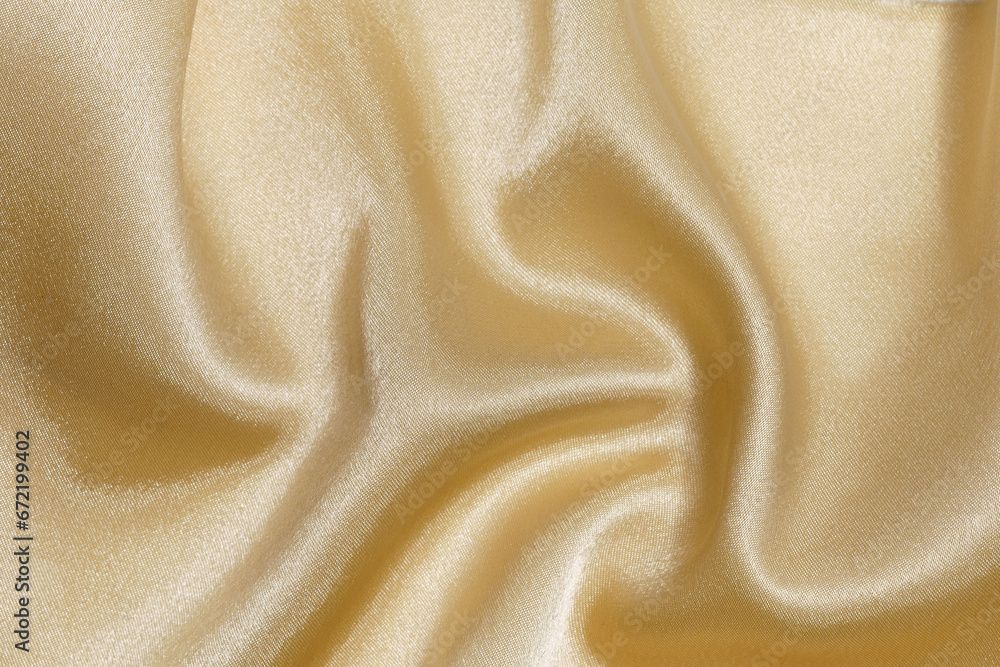 Obraz premium crumpled and wrinkled gold or yellow fabric texture close-up. background for your design