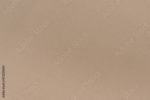 Close-up texture of pink polyester twill fabric. Background for your mockup. Sewing material