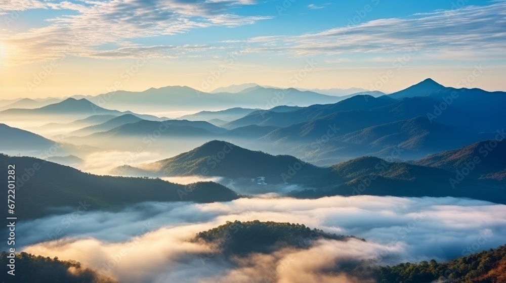 Beautiful Landscape of mountain layer in morning sun ray and winter fog at Thailand