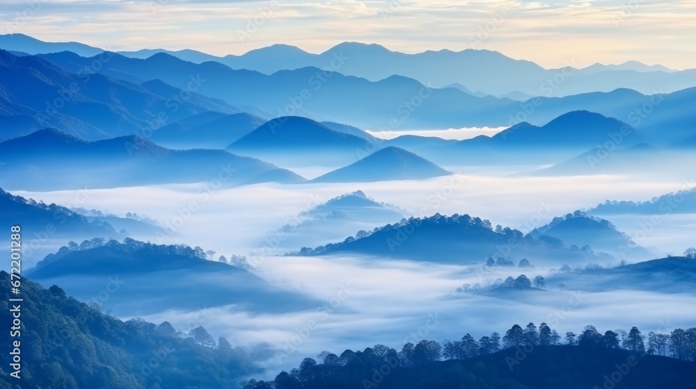 Beautiful Landscape of mountain layer in morning sun ray and winter fog at Thailand