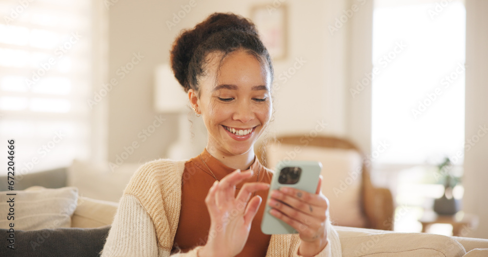 Young woman, phone and laugh on sofa, thinking and relax in home living room for texting, web chat or blog. Girl, excited smile and smartphone with click, meme or social network app on lounge couch