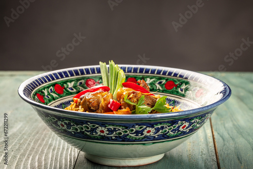 Uzbek pilaf or plov from lamb. Restaurant menu, dieting, cookbook recipe top view photo