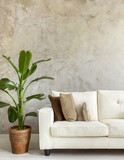 White sofa and potted houseplant against concrete wall. Minimalist home interior design of modern living room, panorama.