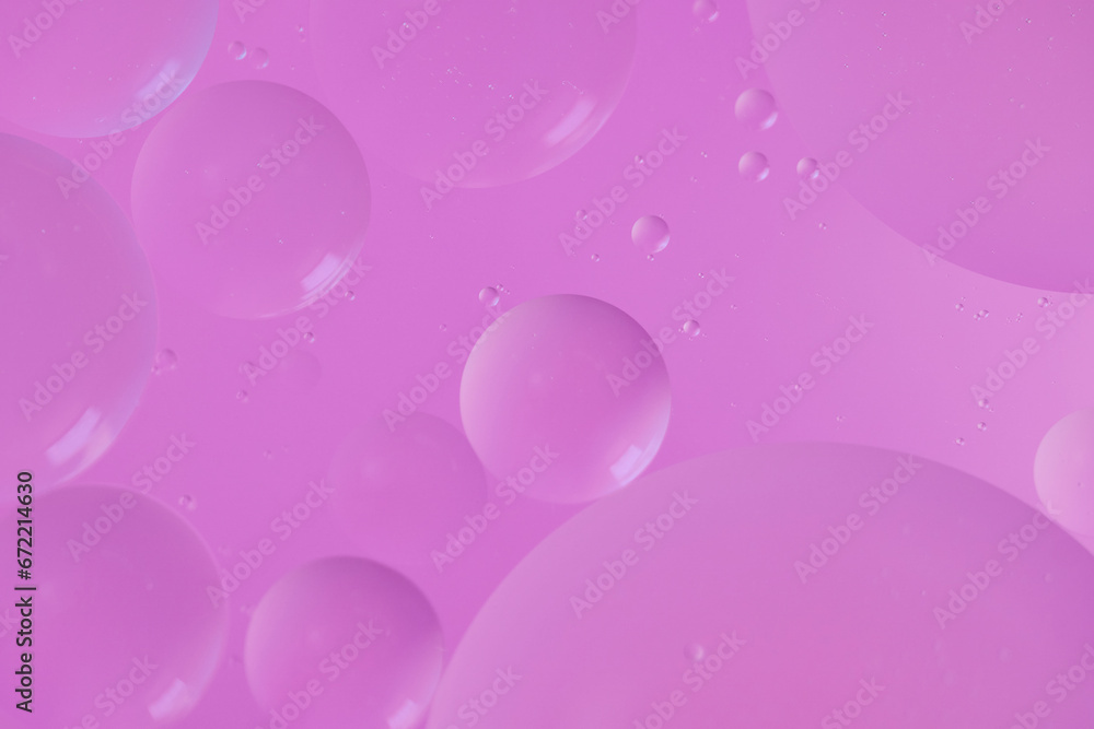 Top view oil bubbles drop on the water with colorful background, Macro photography concept Top view oil bubbles drop on the water with colorful background, Macro photography concept