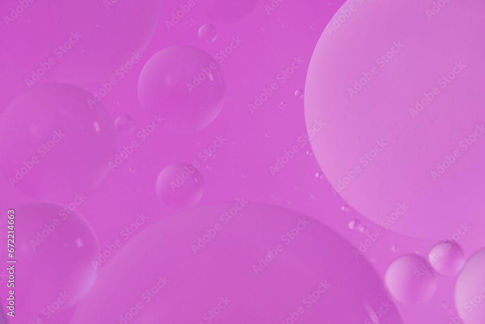 Top view oil bubbles drop on the water with colorful background, Macro photography concept Top view oil bubbles drop on the water with colorful background, Macro photography concept