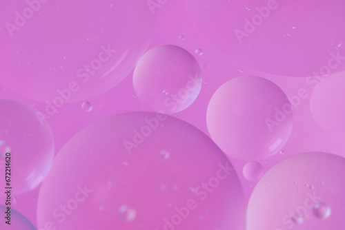 Top view oil bubbles drop on the water with colorful background, Macro photography concept